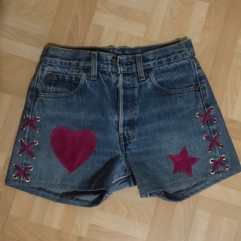 Vintage Levi’s with hot pink suede designs.